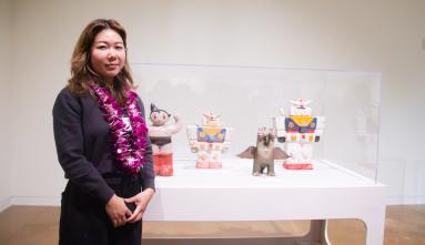 taylor lee in front of her art